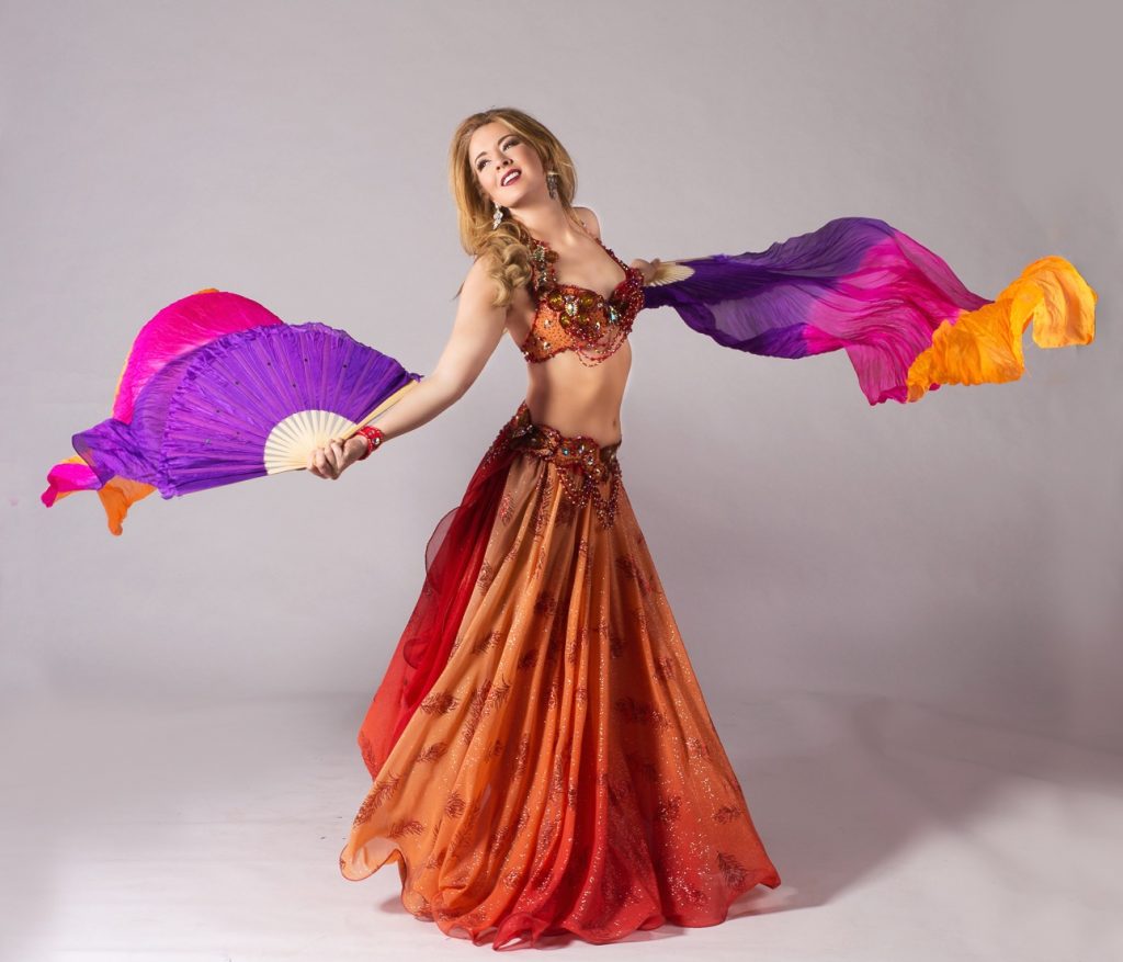 Vancouver Bellydancer Leslie dancing in Orange Costume with Purple fanveils